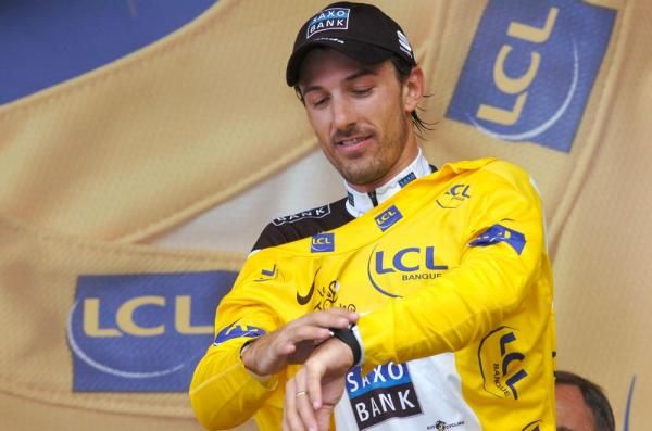 Fabian Cancellara (Saxo Bank) pulls on the yellow jersey