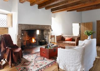 living room with fire lit in 17th century merchants home