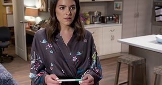 Paige takes a pregnancy test in Neighbours