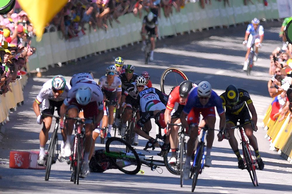 The moment Ben Swift hit Cavendish's bike and flew over the top