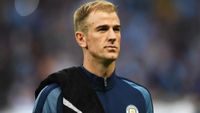 Joe Hart stood in a Manchester City tracksuit.