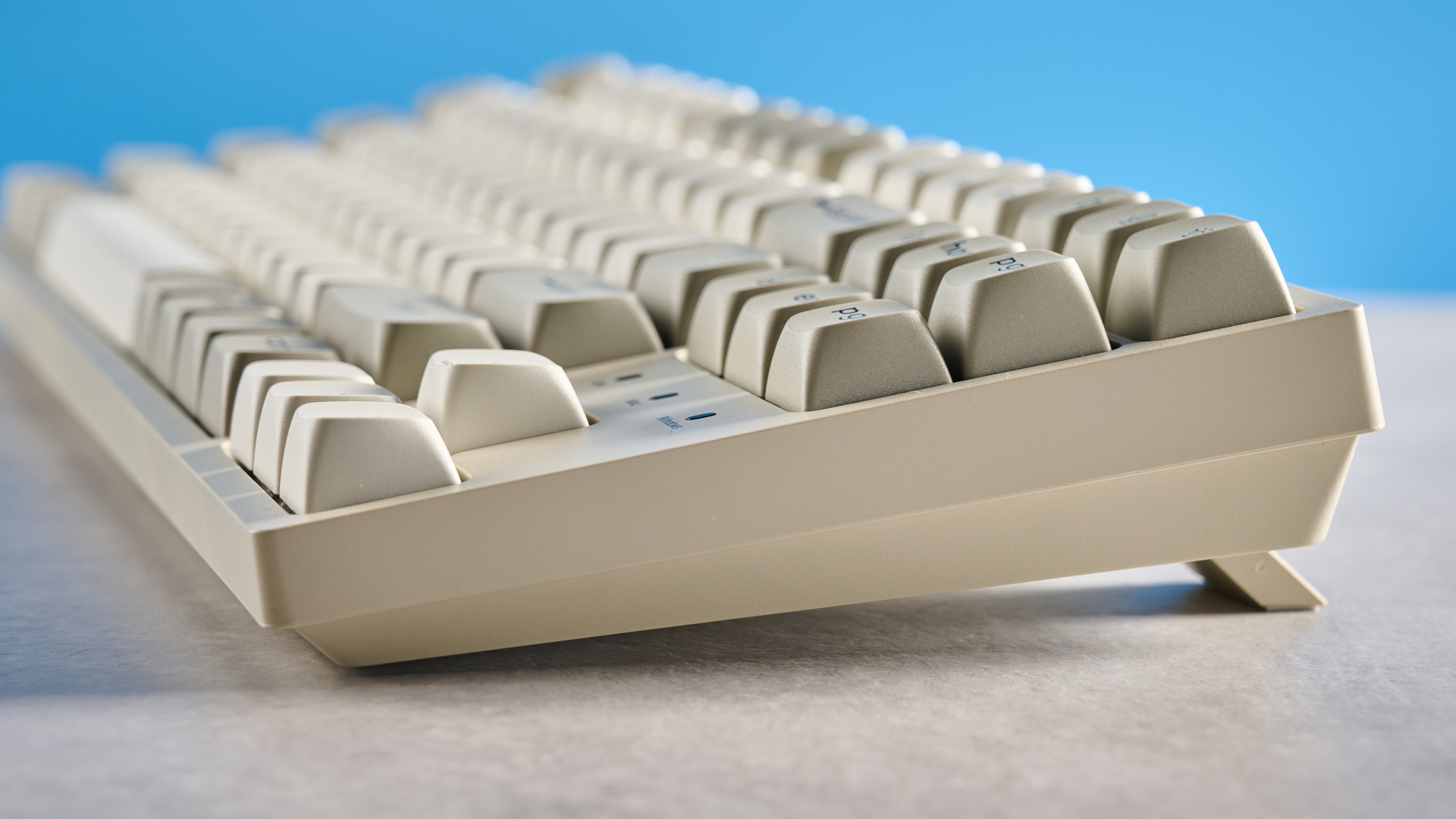 Keychron C1 Pro 8K photographed in front of a blue background.