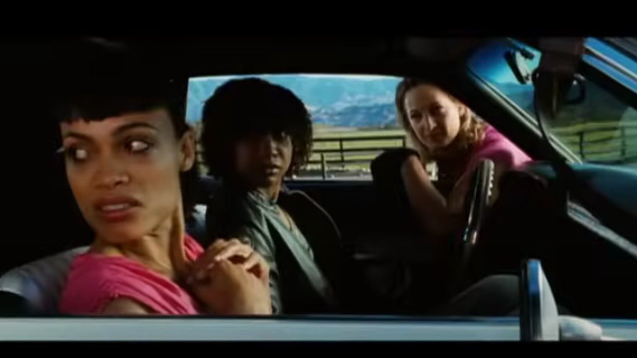 Rosario Dawson, Tracie Thoms, and Zoe Bell looking out for trouble in Death Proof