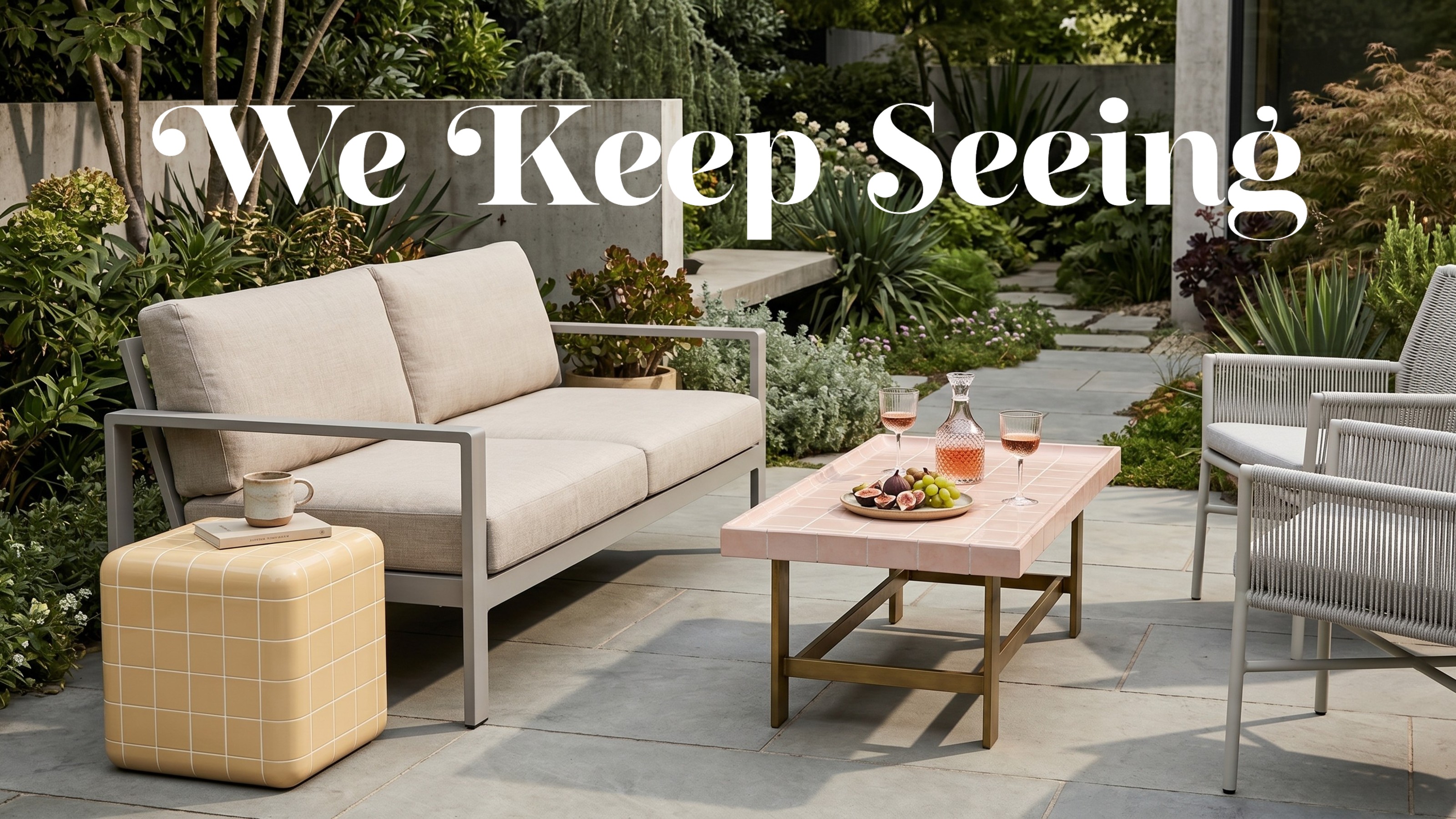 A modern garden with a pink tiled coffee table from Barker and Stonehouse and a butter yellow tiled side table from Westwing next to a light grey outdoor sofa and woven chairs 