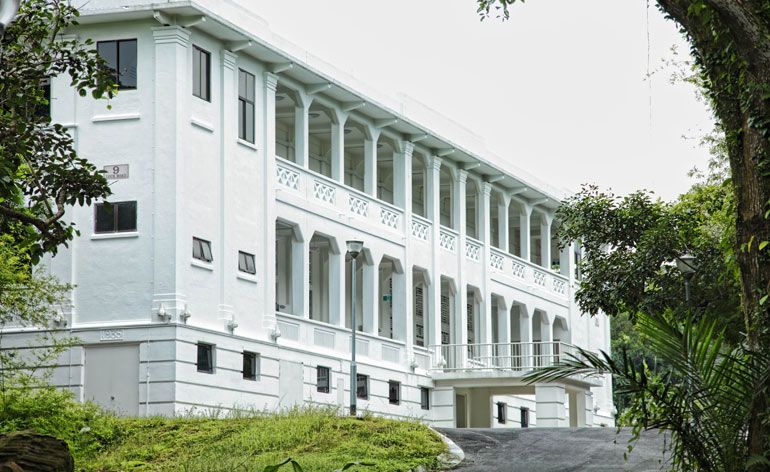 Large, white building with arches