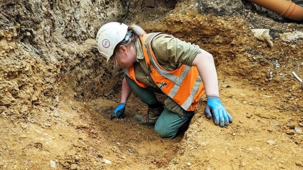 A person working at an archaeological site