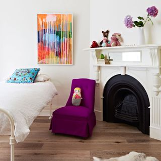 children room with mulberry chair and wooden flooring