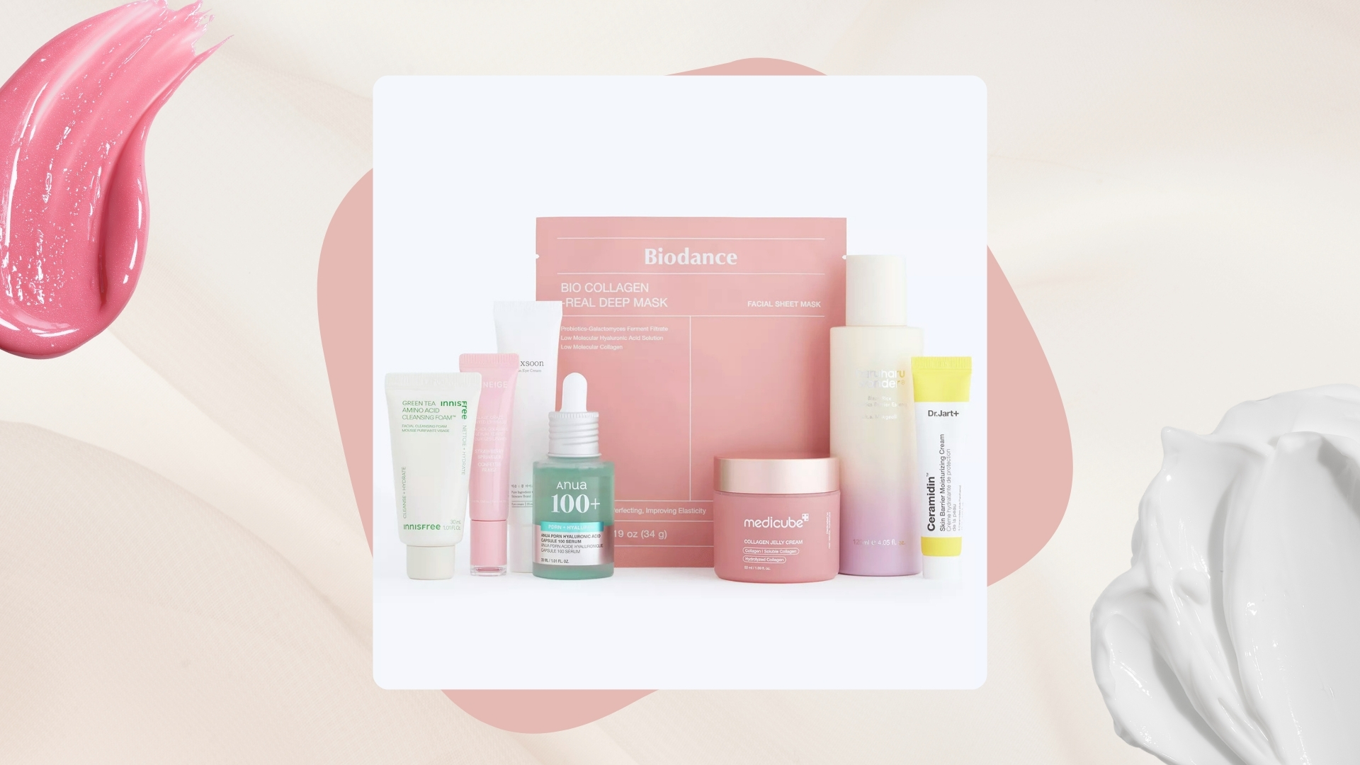 Selfridges The K-Beauty Skincare Kit on a light pink background with pink circle detail, pink lip gloss swatch and white cream swatch