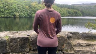 Hiker from the back wearing Columbia Women's Sloan Ridge Graphic Long Sleeve Technical T-Shirt