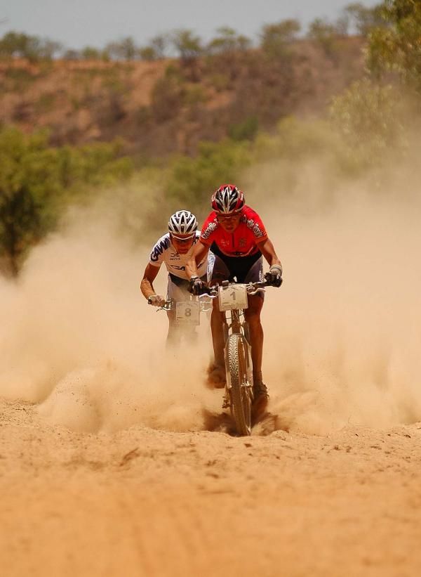 Bart Brentjens leads Urs Huber through the sand.