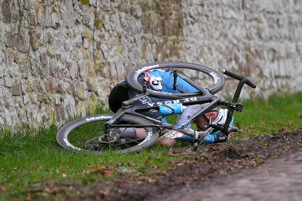 August Jensen (Israel Cycling Academy) on the deck after crashing in Le Samyn