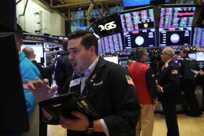 Traders on the NYSE floor as the Dow drops