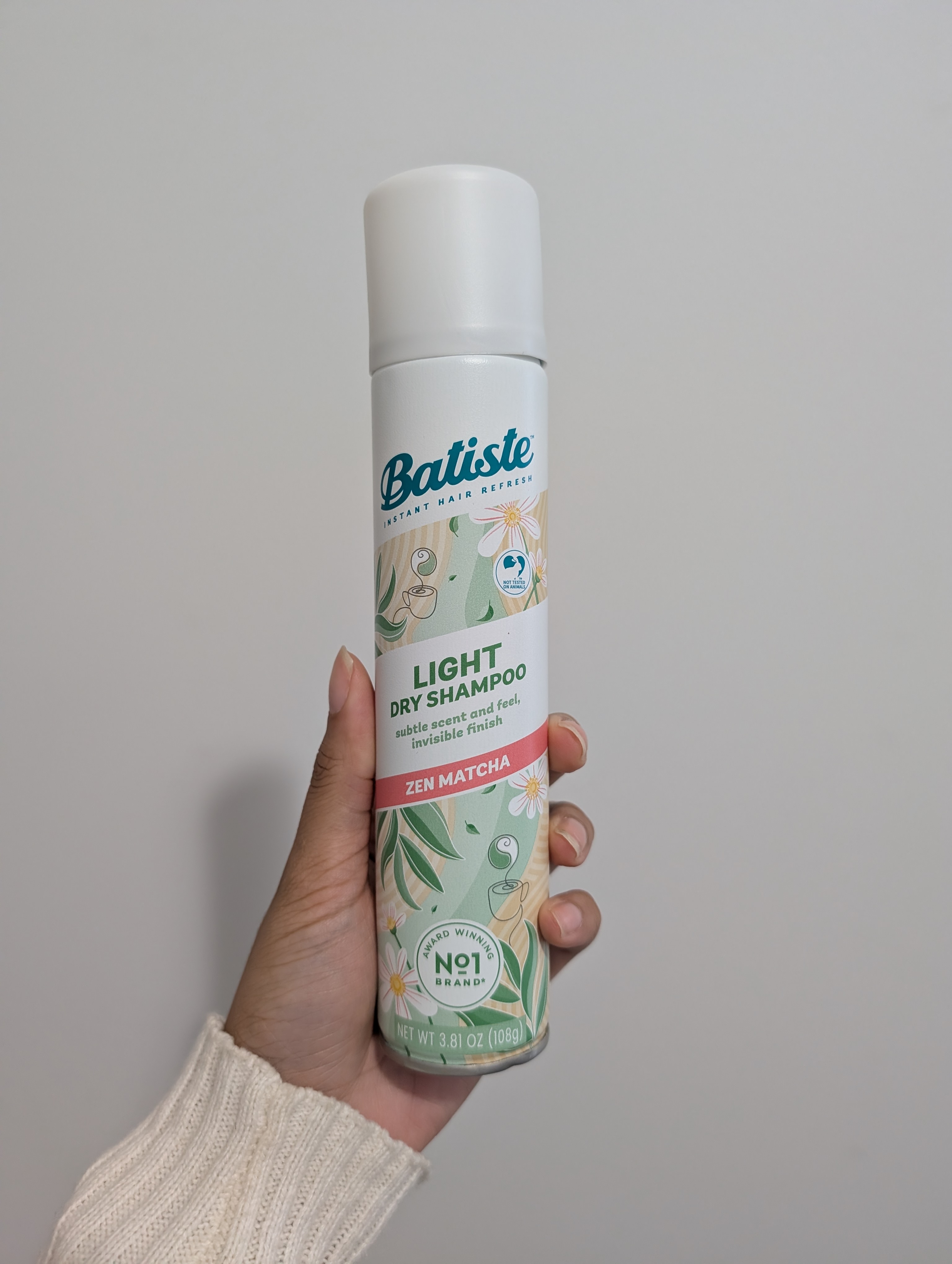 Photo of tester holding the Batiste Light Dry Shampoo