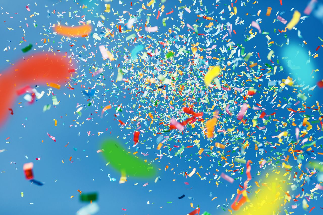 Low Angle View Of Confetti Against Clear Sky