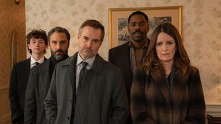 The Four Seasons cast standing side by side wearing dark outfits