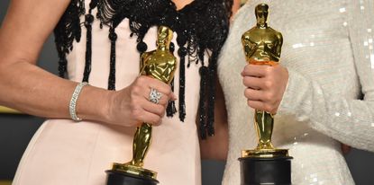  Laura Dern, winner of the Actress in a Supporting Role award for &quot;Marriage Story,&quot; and Renée Zellweger, winner of the Actress in a Leading Role award for &quot;Judy,&quot; statuette detail, pose in the press room during the 92nd Annual Academy Awards