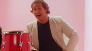 Chevy Chase in the video for You Can Call Me Al