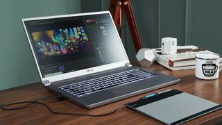 MSI P65 Creator on a desktop with video editing software open