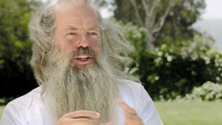 Producer Rick Rubin with a long gray beard being interviewed in 808