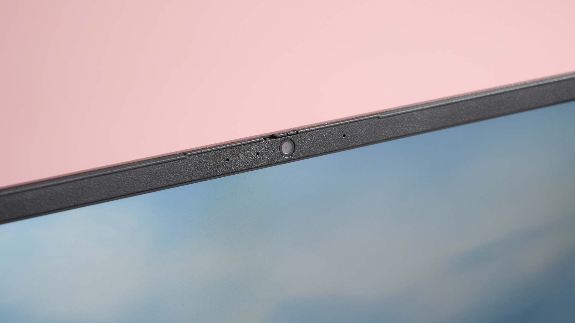 Close-up of webcam on Medion Erazer Deputy 15 P1, with pink wall in background