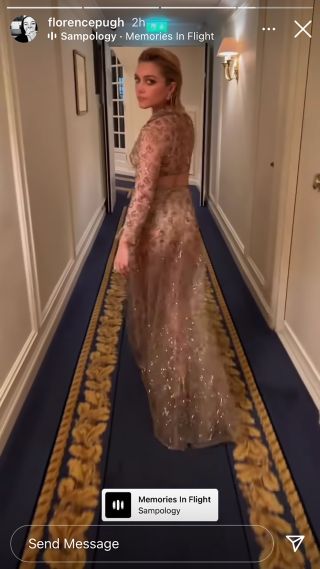 Florence Pugh walking in her sheer Valentino outfit.