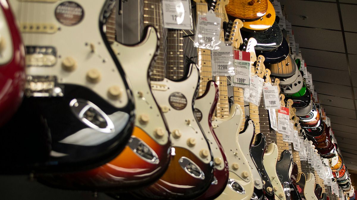 Electric guitars hanging on walls