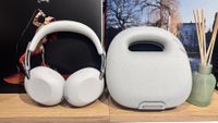 Sony 1000X The Collexion over-ear wireless headphones in white next to their white case