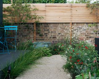Self-binding gravel creates a weed-free naturalistic-looking path ideally suited to an informal flower garden