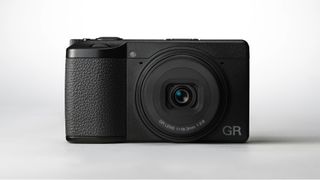 Ricoh GR IV camera on a white background