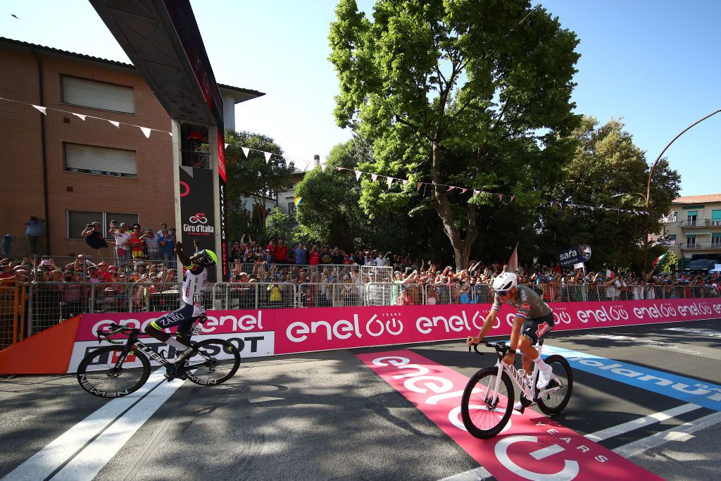 JESI ITALY MAY 17 LR Hailu Biniam Girmay of Eritrea and Team Intermarch Wanty Gobert Matriaux celebrates at finish line as stage winner ahead of Mathieu Van Der Poel of Netherlands and Team Alpecin Fenix during the 105th Giro dItalia 2022 Stage 10 a 196km stage from Pescara to Jesi 95m Giro WorldTour on May 17 2022 in Jesi Italy Photo by Michael SteeleGetty Images