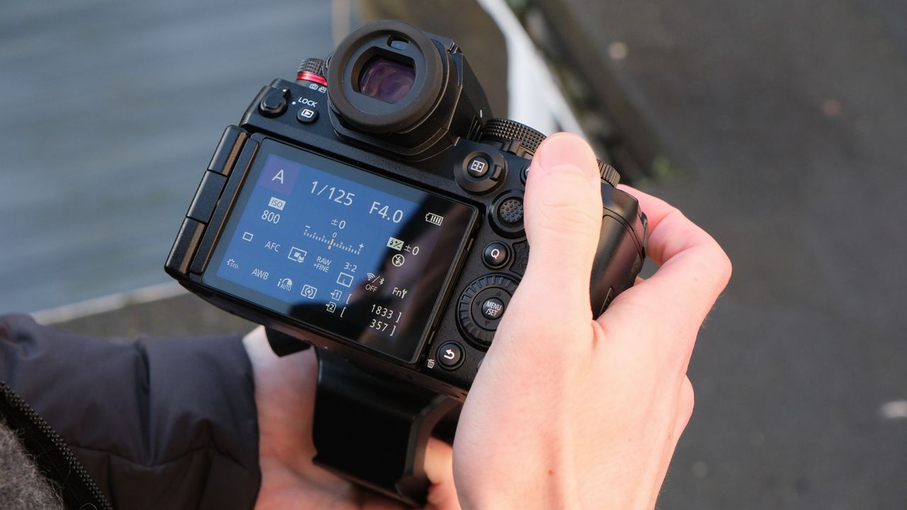 Panasonic Lumix S1R II camera from behind with the menu displayed on the screen
