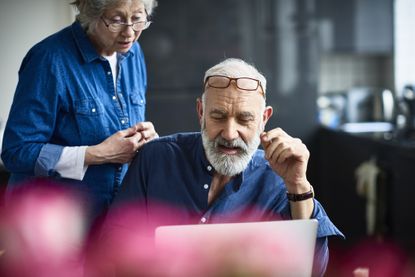 pensioners looking at laptop