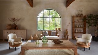 rustic living room with arched window 