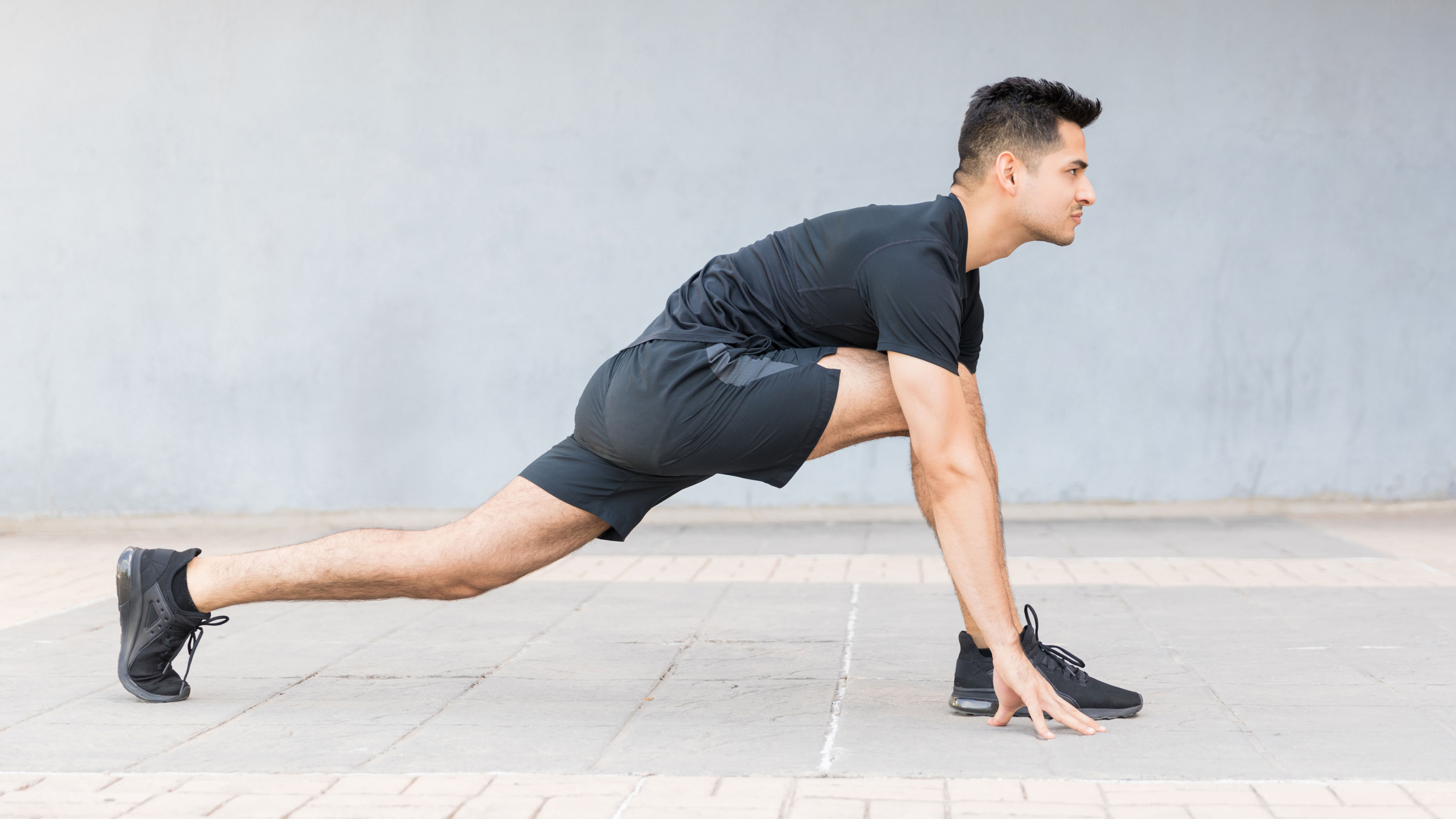 Man doing running low lunge yoga move