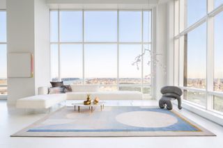 large white and blue rug in a large white living room