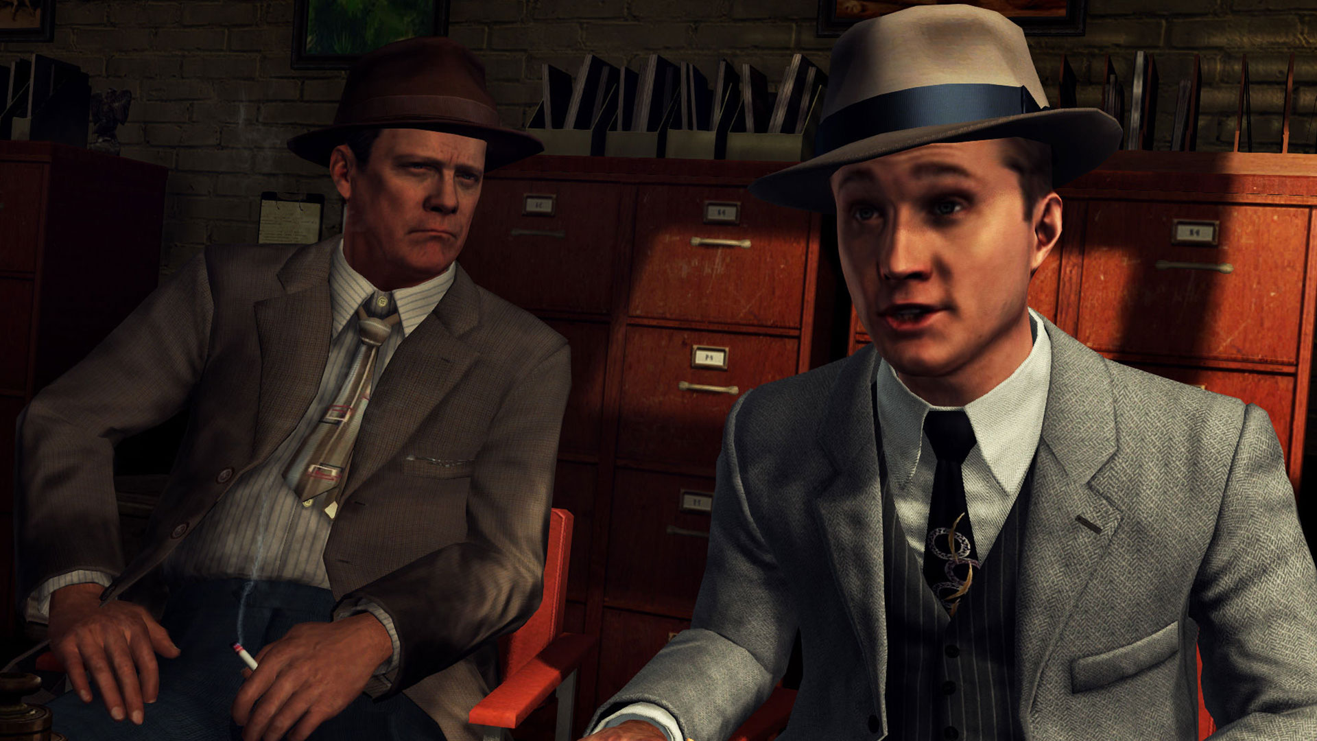 Dos personajes apuntando a la cámara en LA Noire