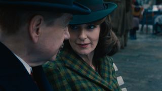 Poirot (Kenneth Branagh) and Rowena (Tina Fey) chat in A Haunting of Venice