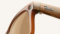 Close up shot of Ray-Ban Meta smart glasses showing Ray-Ban logo with internal circuitry through semi transparent frame