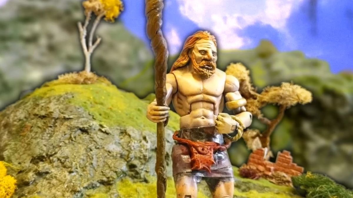 Judero, an action figure claymation druid man with an orange beard and staff, contemplates nature