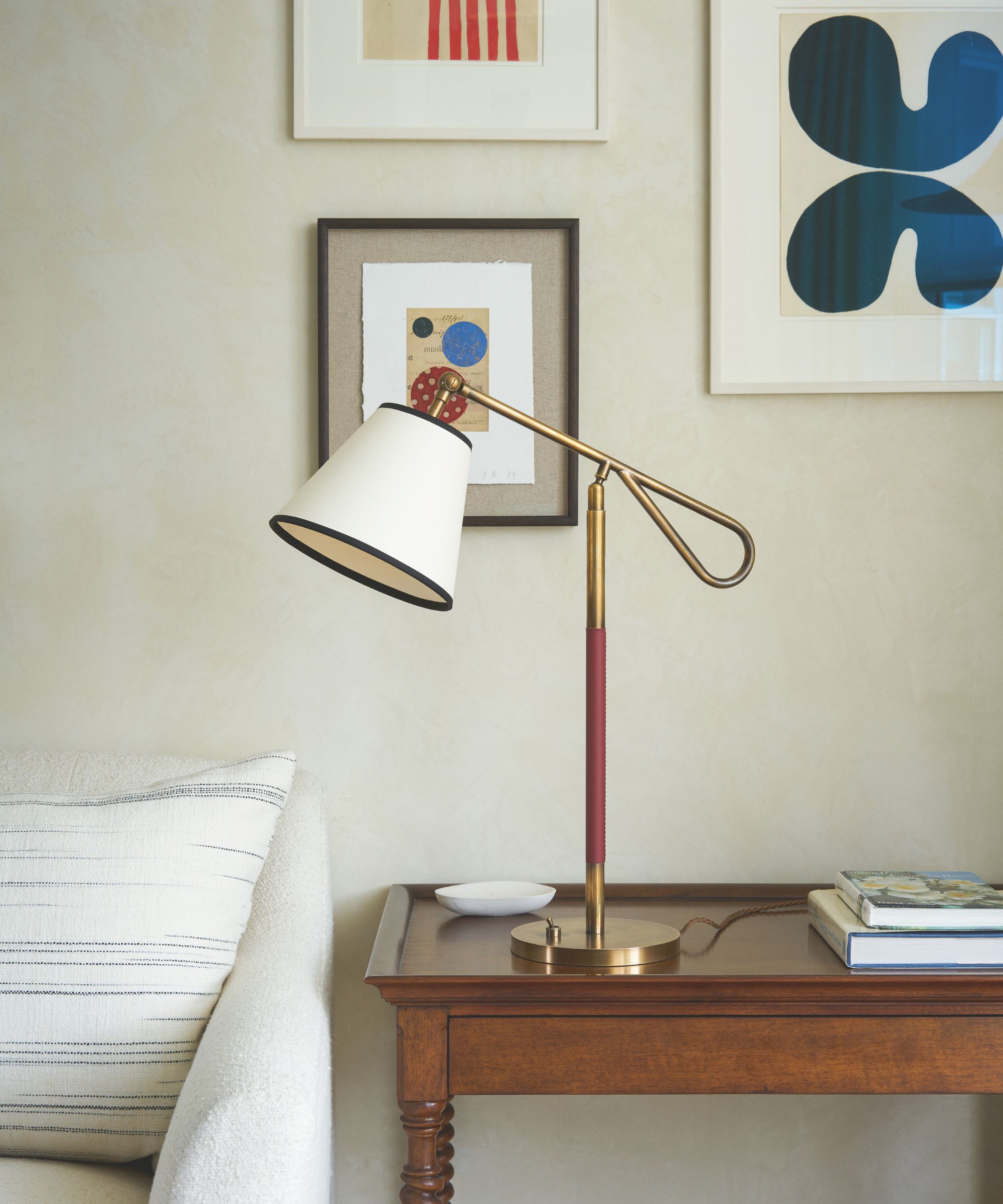 A small lamp on an antique table