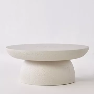 white concrete coffee table