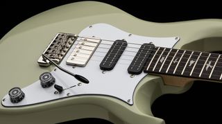 A photo of the PRS SE Studio Standard in Sage Green finish