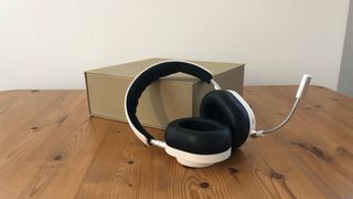 Master Dynamic MG20 headset on wooden surface