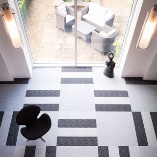 four types of tile planks with black chair