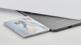 Oppo Find N5 next to a stack of 4 credit cards