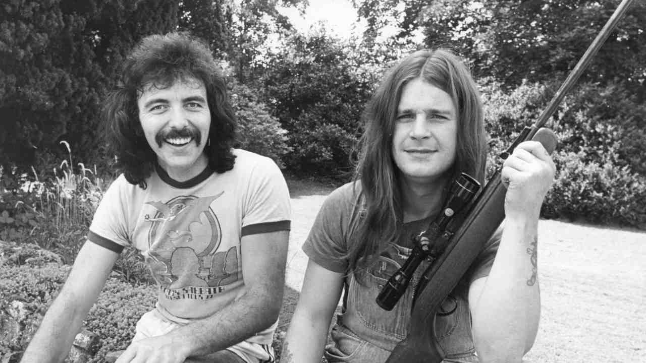 Black Sabbath&amp;rsquo;s Tony Iommi and Ozzy Osbourne holding an air rifle in 1977