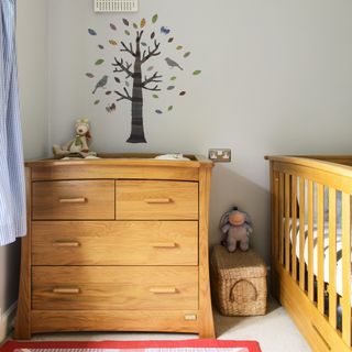 nursery with wooden chest and cot