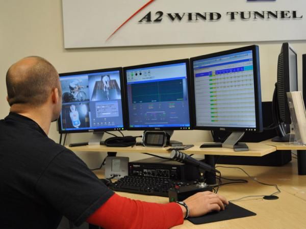 Mike Giraud, A2 Wind Tunnel's director of cycling programs, monitors video and data readings for a Team Type 1 rider's session.