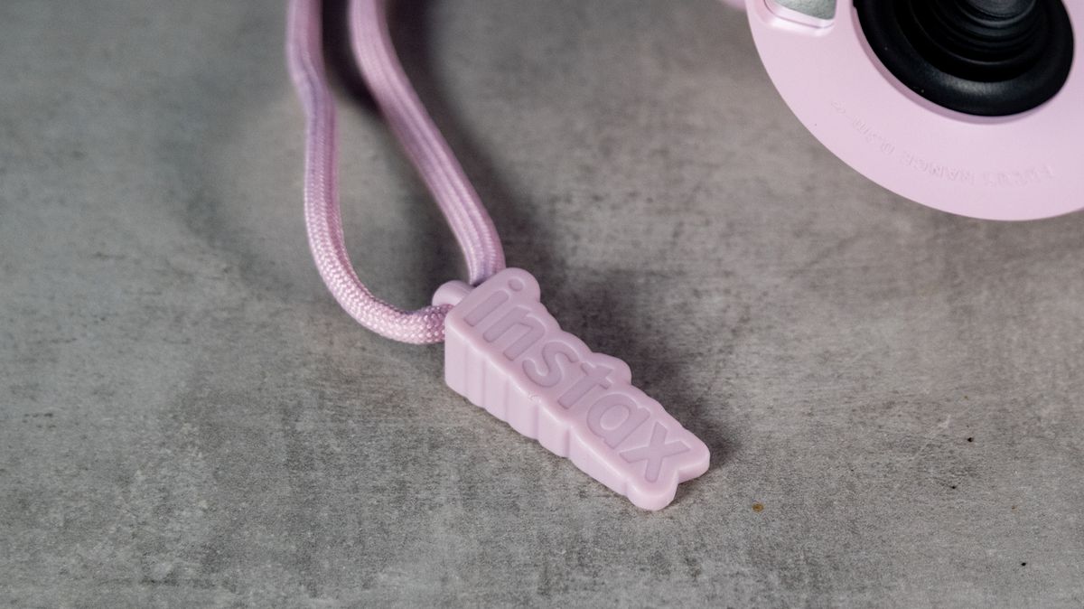 A Candy Pink Fujifilm Instax mini 13 instant camera