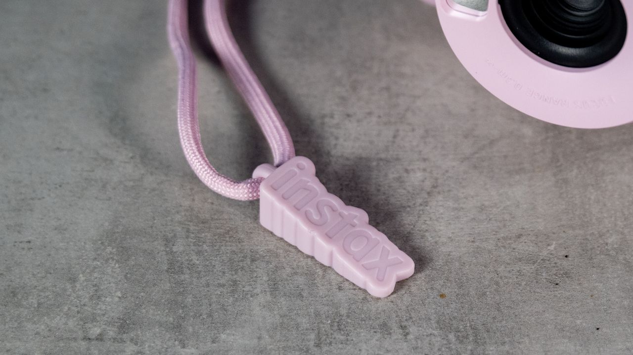 A Candy Pink Fujifilm Instax mini 13 instant camera